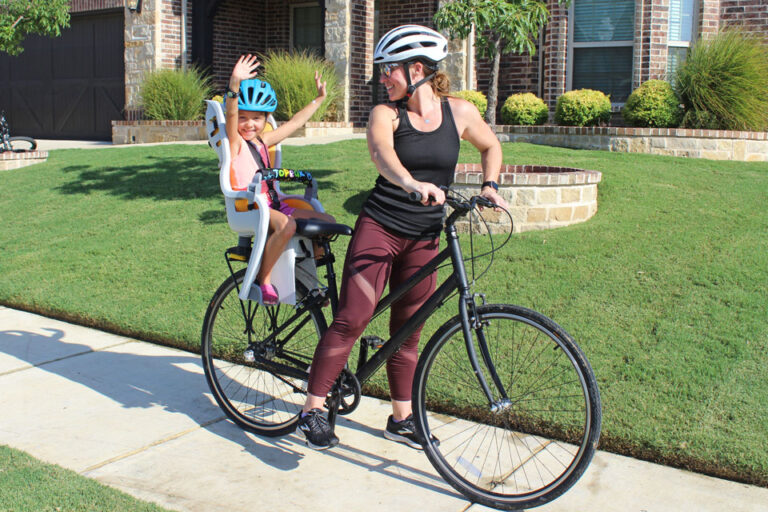 Young girl riding in Topeak BabySeat II child bike seat
