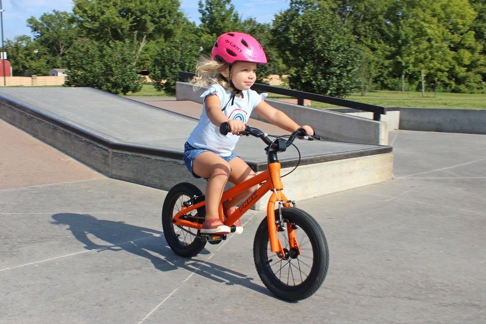 2 year old riding Park Cycles 14 kids bike down the ramp at the skate park