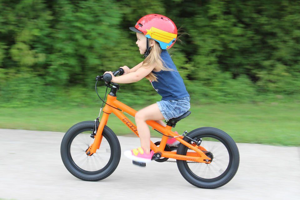3 year old riding Park Cycles 14" on a paved trail