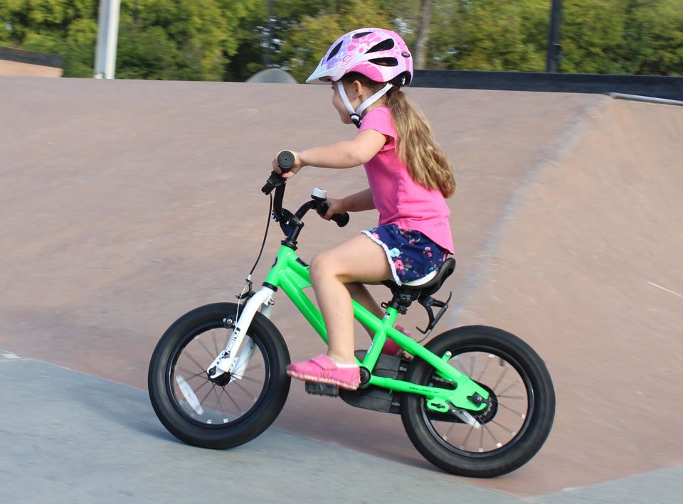 4 year old riding Royal baby Bike at skate park