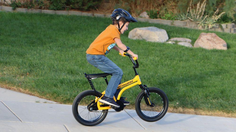 8 year old popping a wheelie on Schwinn Krate EVO kids bike