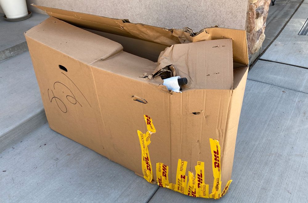 Wrecked up shipping box of Vitus 20 inch kids bike.