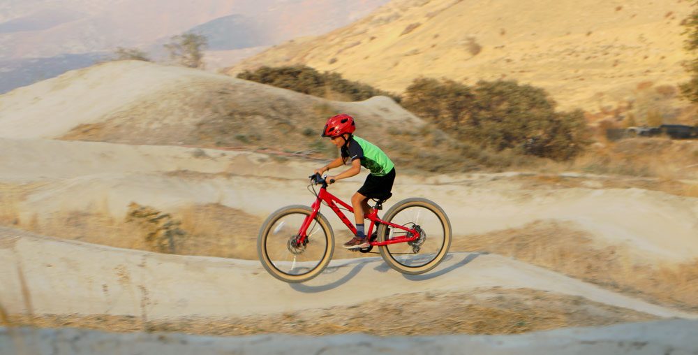 9 year old speeding through berm on Vitus Plus 24 inch kids bike