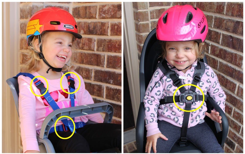 Toddler sitting in Bell Cocoon, showing three different buckles of the harness. Side by side comparison of another seat with a five point harness with one central buckle.