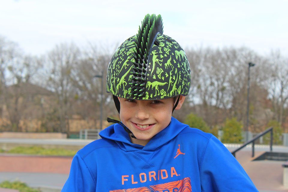 Boy wearing Raskullz helmet at the skatepark