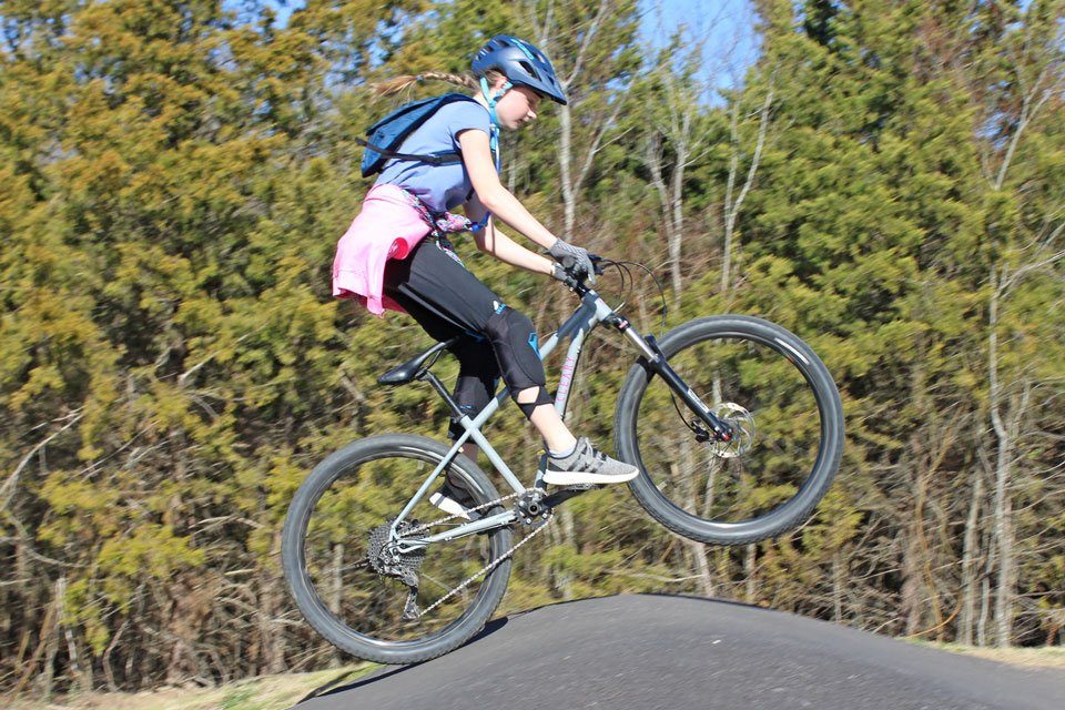 Girl jumping on Cleary Scout 