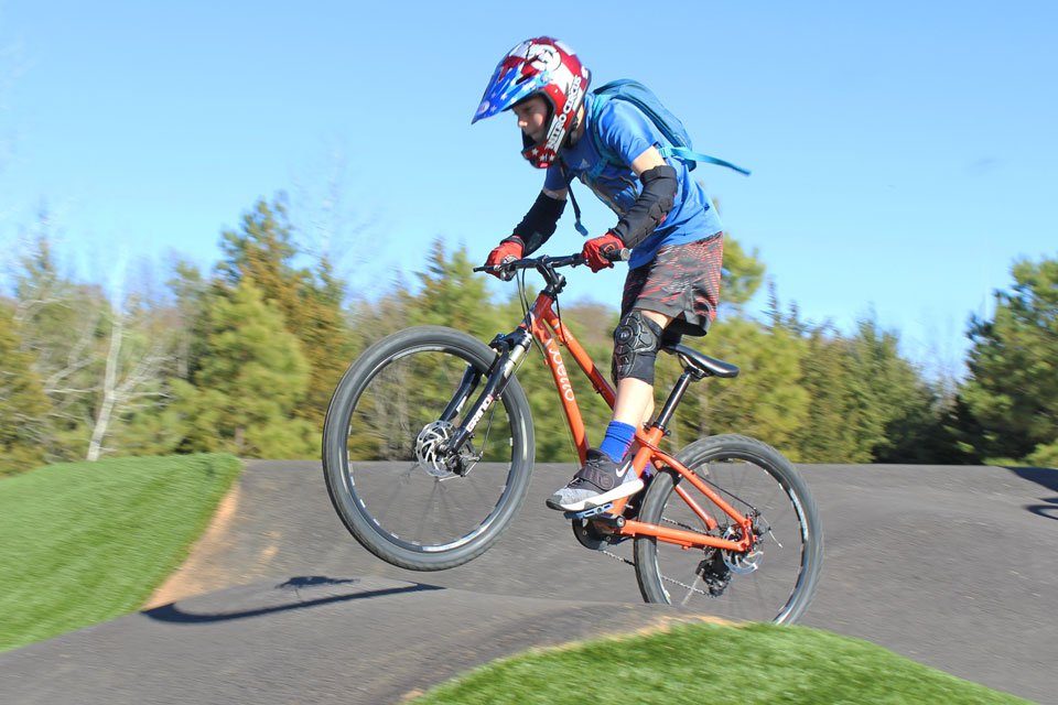 Boy riding Pello Reyes on Velosolutions pumptrack