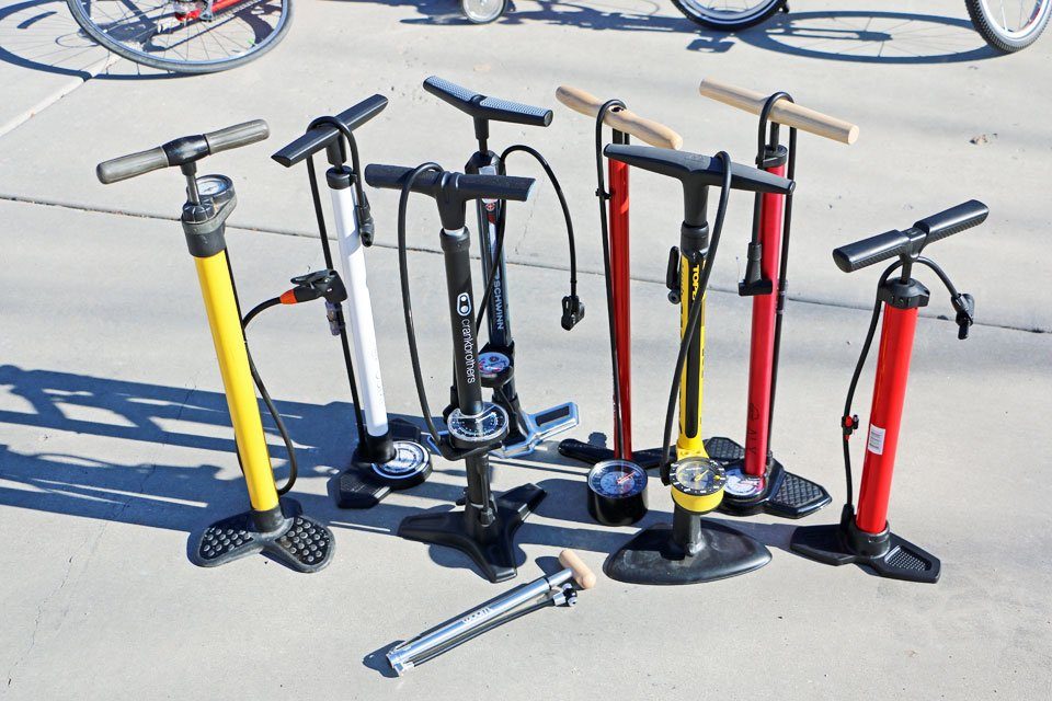 collage of 9 different bike pumps for families in a test to find the best, including presta valve pumps and schrader