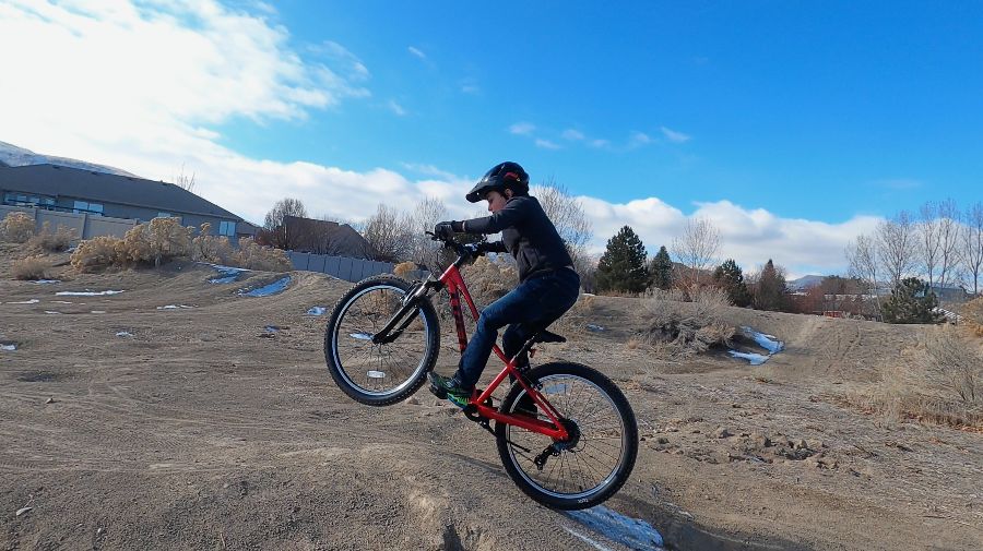 boy catching air on a trek precaliber 24