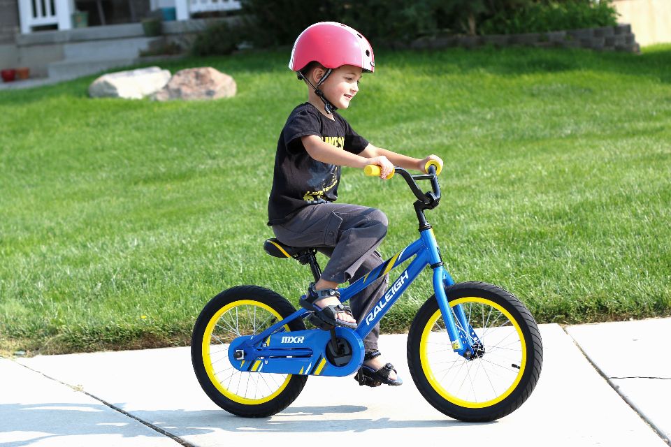 boy riding a raleigh mxr bike with a coaster brake