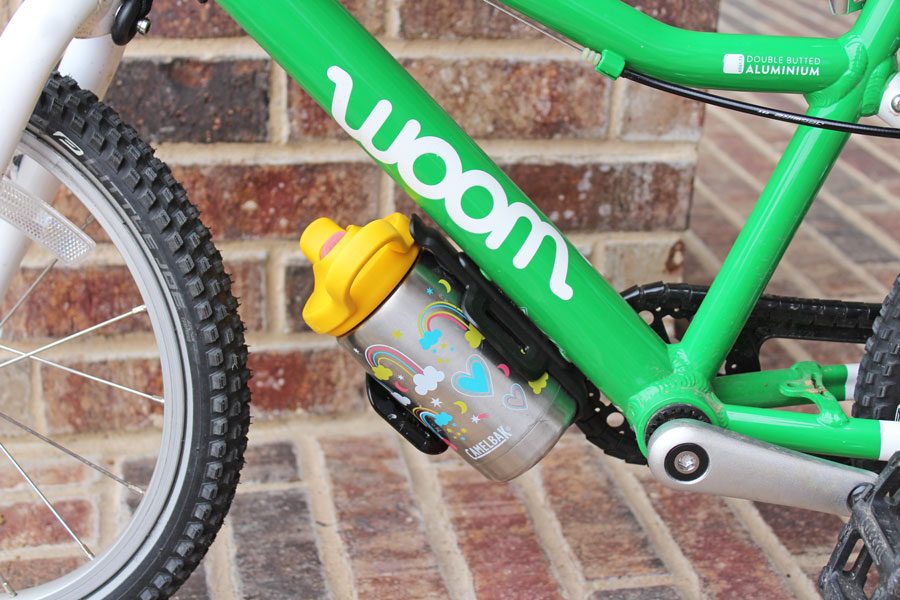 Camelbak Eddy Kids water bottle loaded into a kids bike water bottle holder
