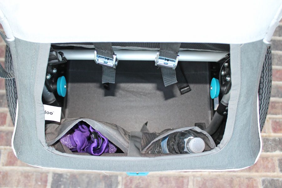 Rear storage area of the single Kidgoo with interior pocket for gloves and water bottle