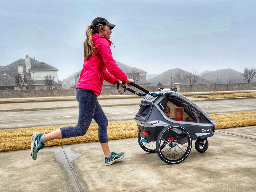 Mom running with the Qeridoo Kidgoo in jogger mode