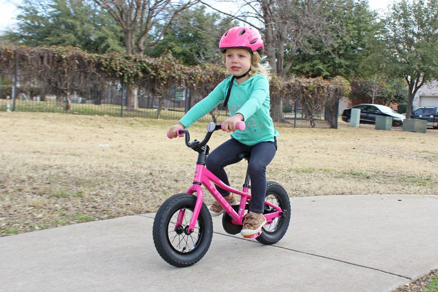 3 year old riding Precaliber 12 down the sidewalk