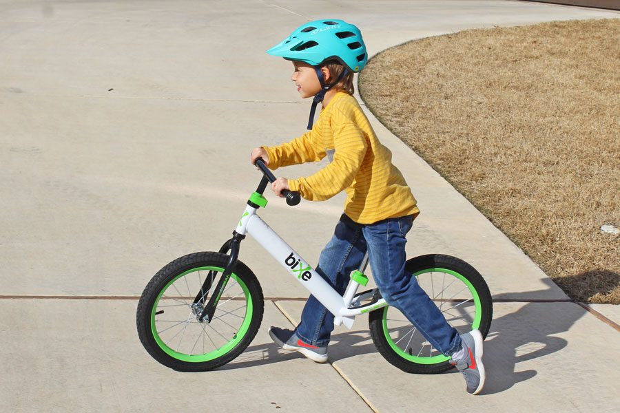 1st grader riding larger Bixe 16 balance bike