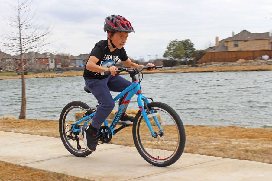 boy riding the polygon premier ultralight 20 inch bike