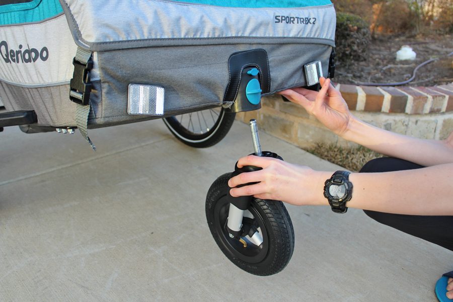 Inserting the Sportrex stroller wheel from underneath
