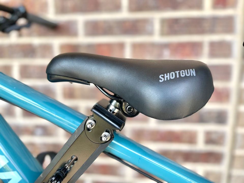 Thickly padded saddle of Shotgun seat