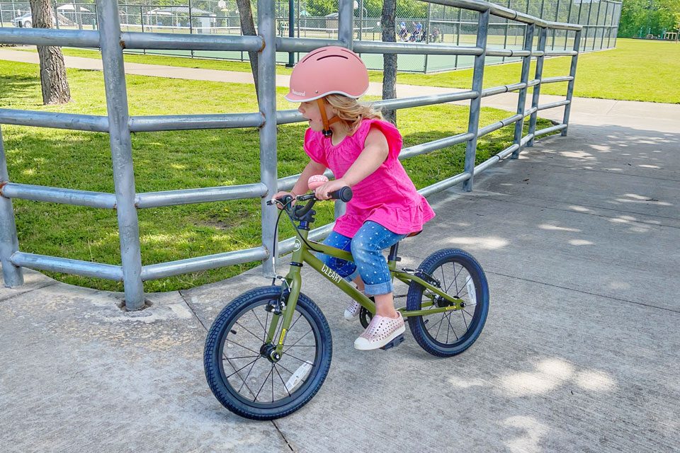 3 year old riding Cleary Hedgehog and turning around a corner