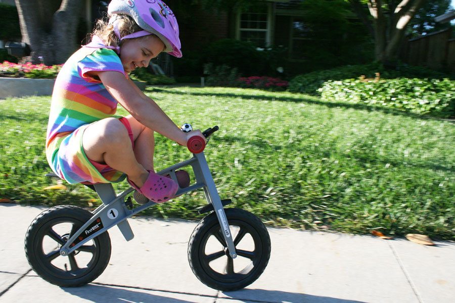 preschool girl balancing on a FirstBIKE