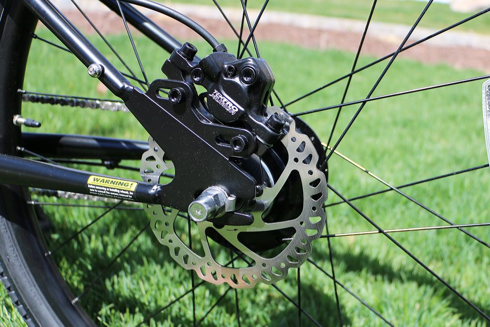 Close up shot of the Tektro hydraulic disc brakes on the Cleary Meerkat 24