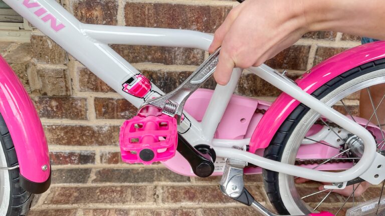 Loosening left pedal on kids bike to take it off