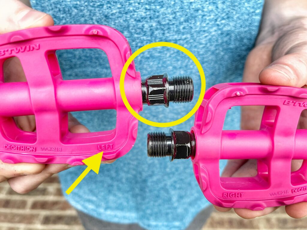 Left and right bike pedals, showing grooves on left pedal