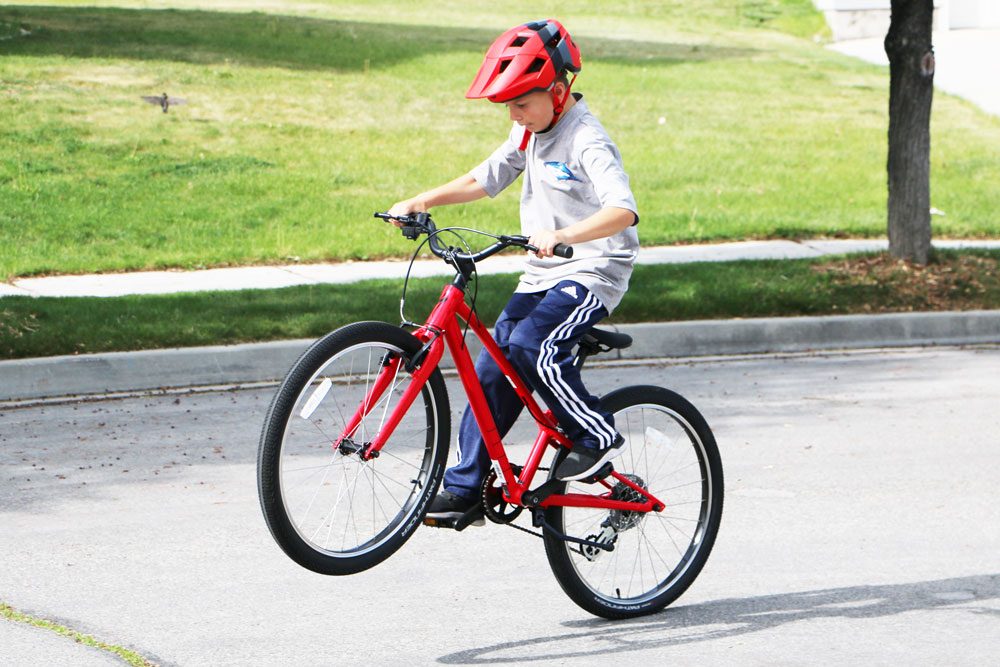 kid riding the specialized Jett 24 inch bike