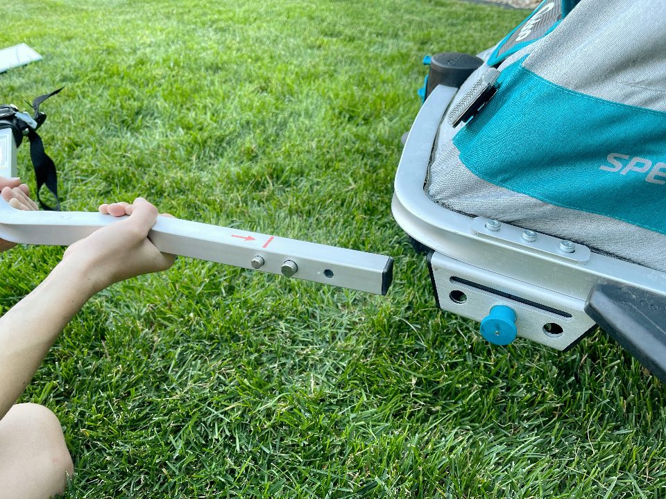 Inserting the tow arm into the receiver at the front of the Speedkid
