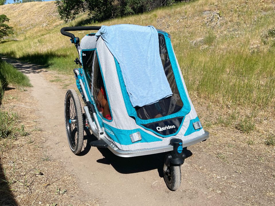 Shirt draped over front of Speedkid as a makeshift shade