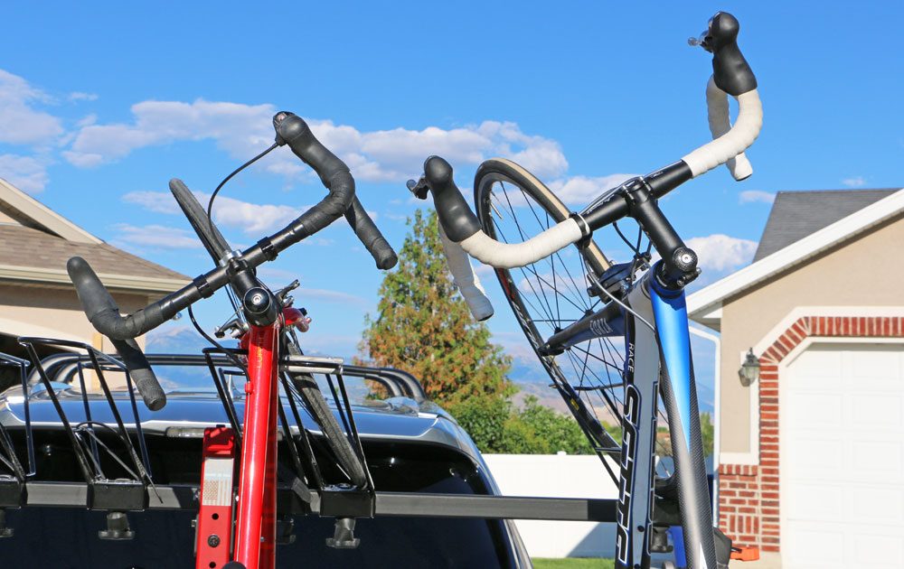 two road bikes with dropper handlebars loaded up on the alta vertical bike rack