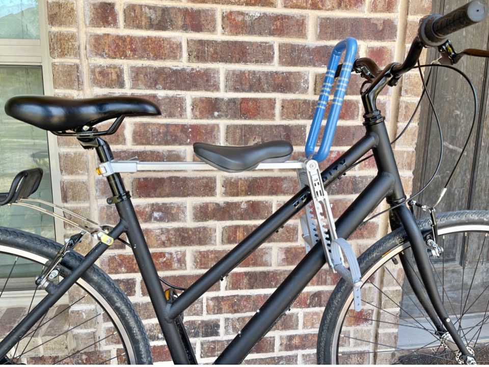 Side view of UrRider child bike seat mounted on Priority bicycle