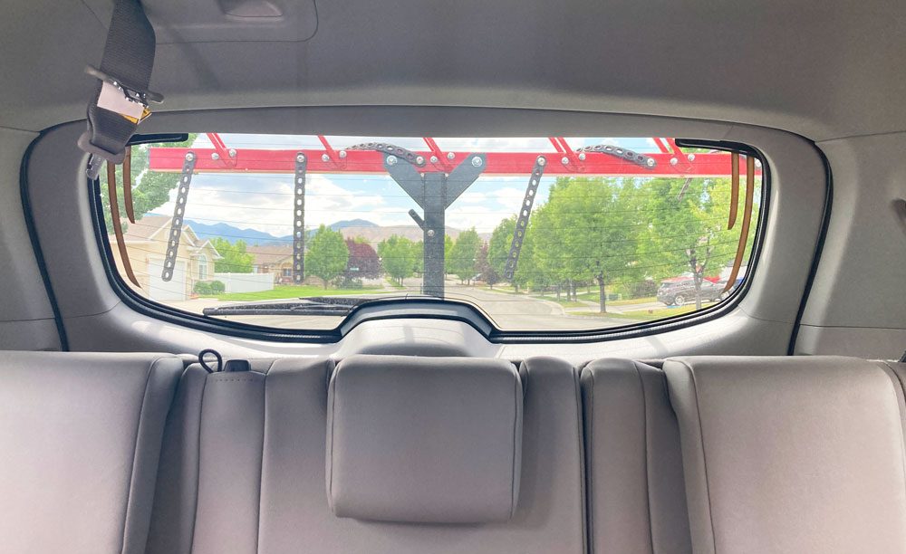 image showing how a vertical rack doesn't interfere with the drivers view out the rear window very much