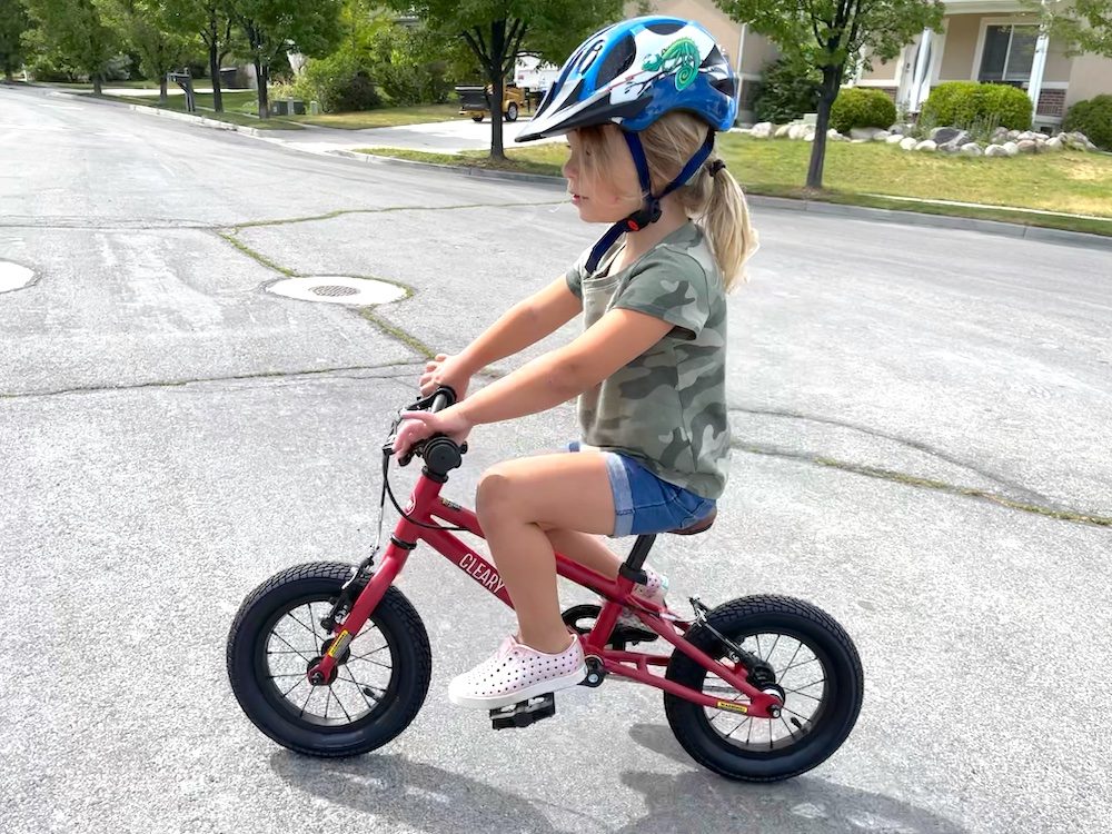 tall preschooler riding the Cleary Gecko 12 inch bike 
