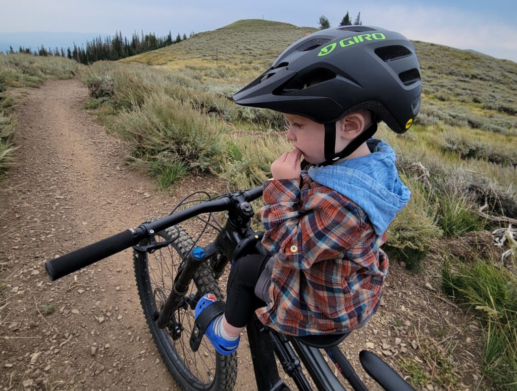 View of a 2-year-old sitting on the Mac Ride bike seat
