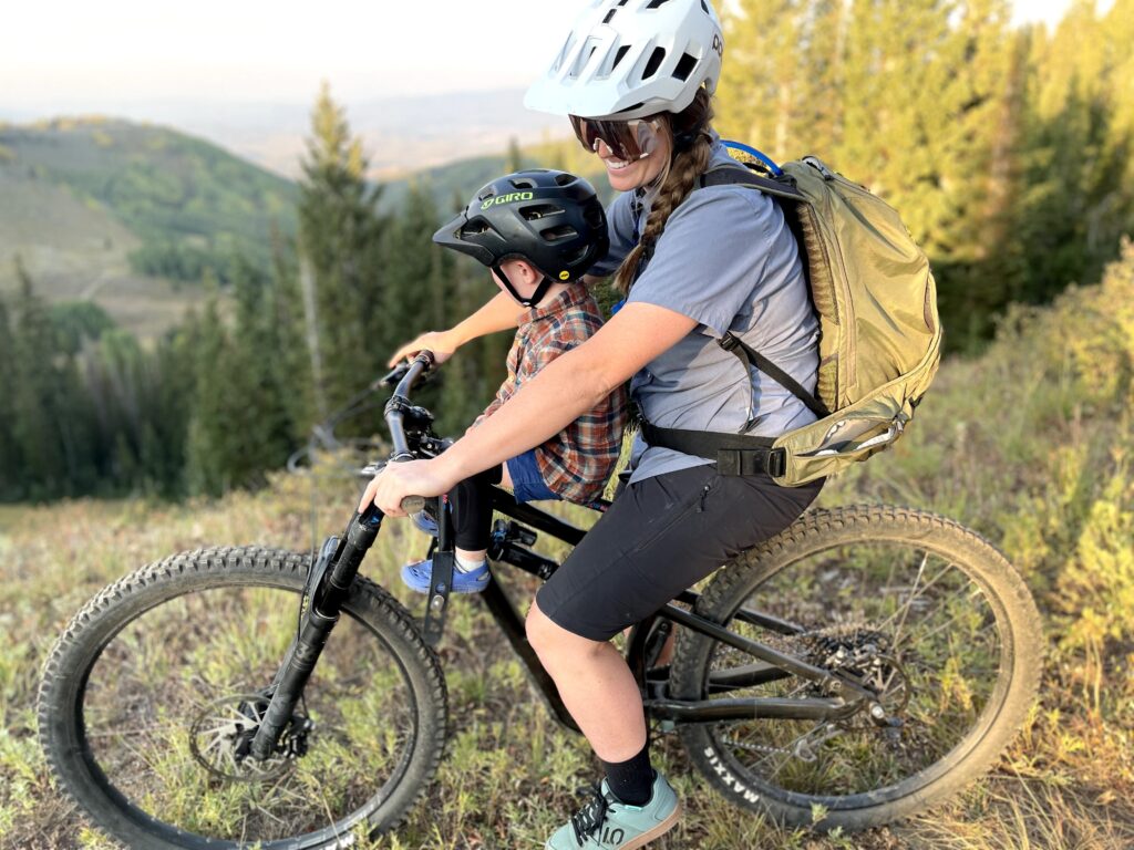 Mom and son mountain biking with Mac Ride bike seat in Utah.