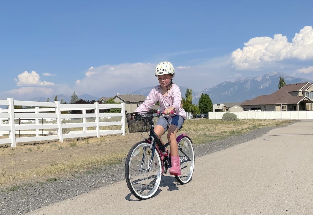 girl enjoying riding the decathlon btwin Original 500 bike