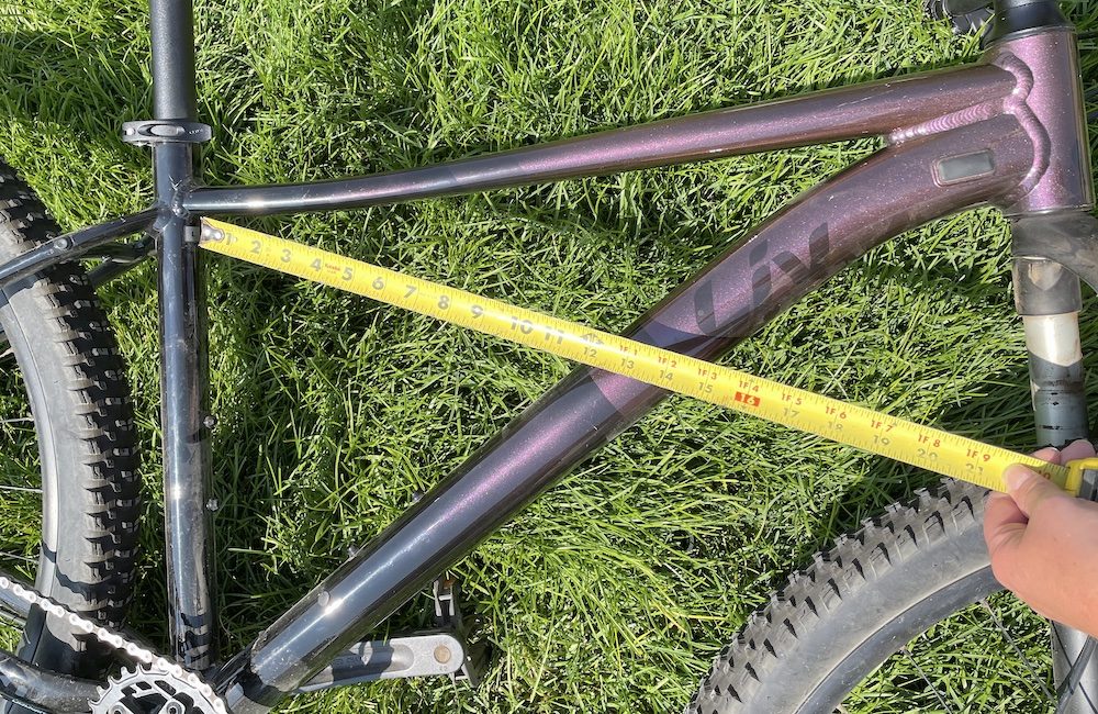 image showing measuring the Liv Tempt to see if it fits on the Thule Passage