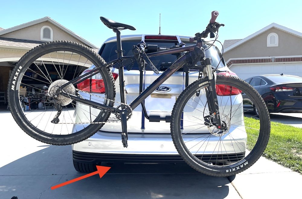 bike loaded with the front tire pointing away from the exhaust on the thule passage