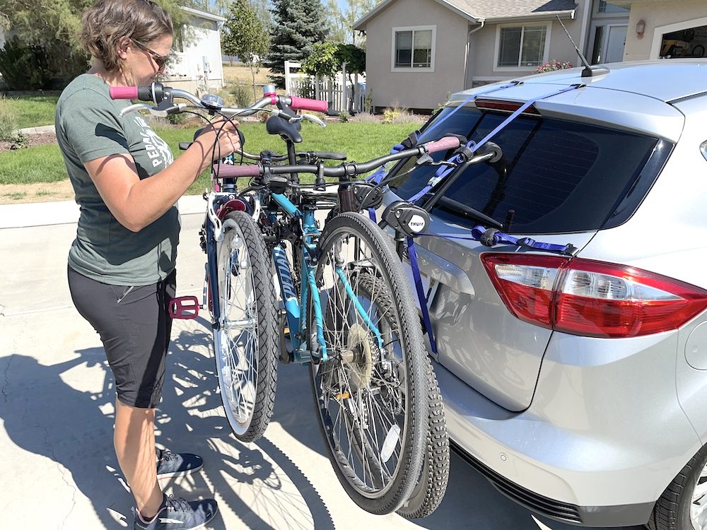 loading bikes onto the Thule Passage trunk bike rack