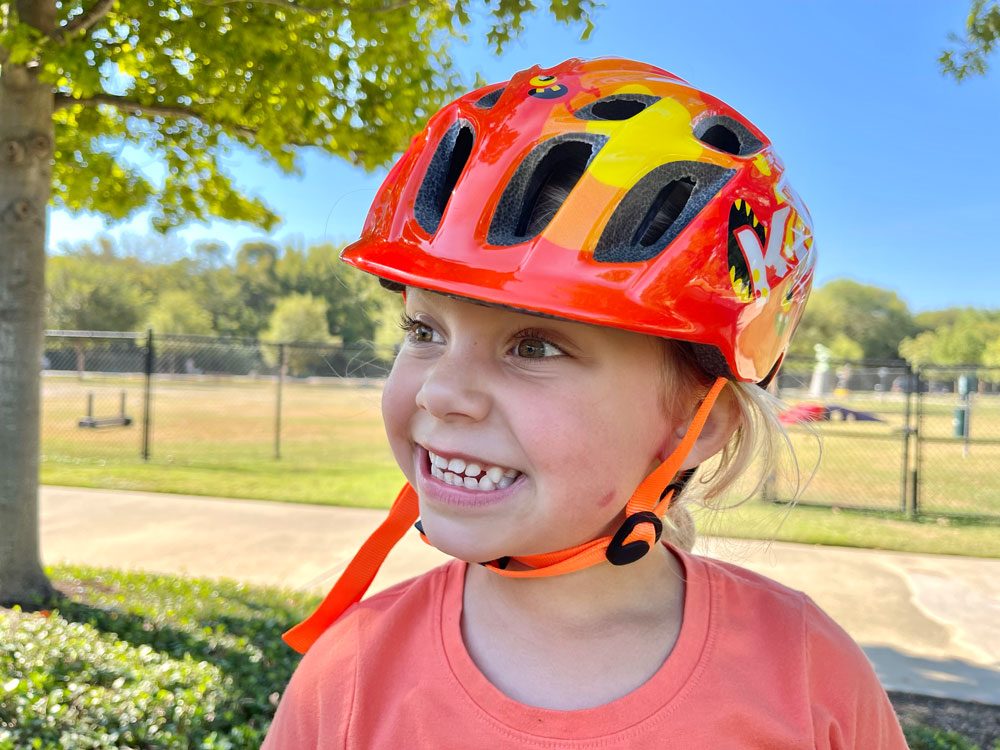 young girl in the kali chakra Child toddler bike helmet