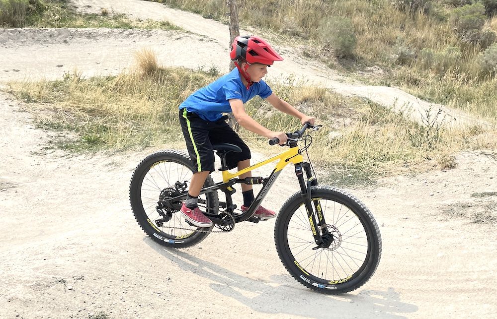 young child riding the Polygon Siskiu full suspension mountain bike