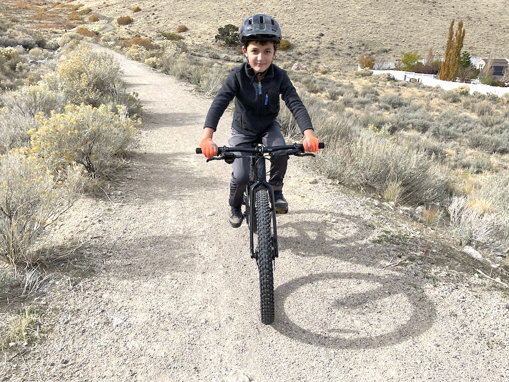 Child riding the Specialized Riprock 24 showing his hands on the handlebar