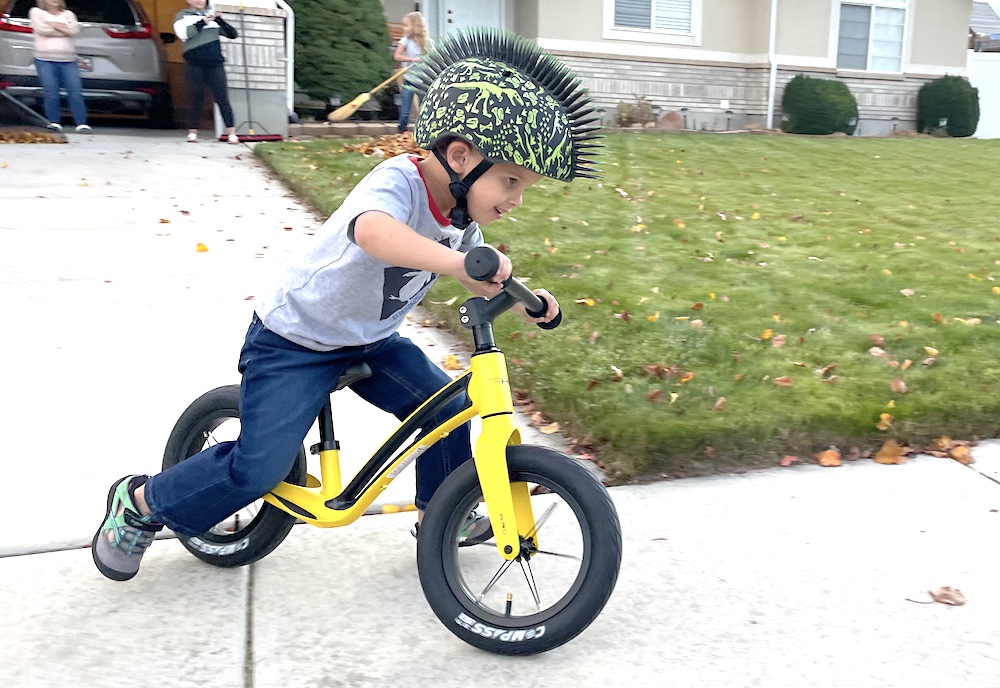 smiling toddler riding the Hornit AIRO