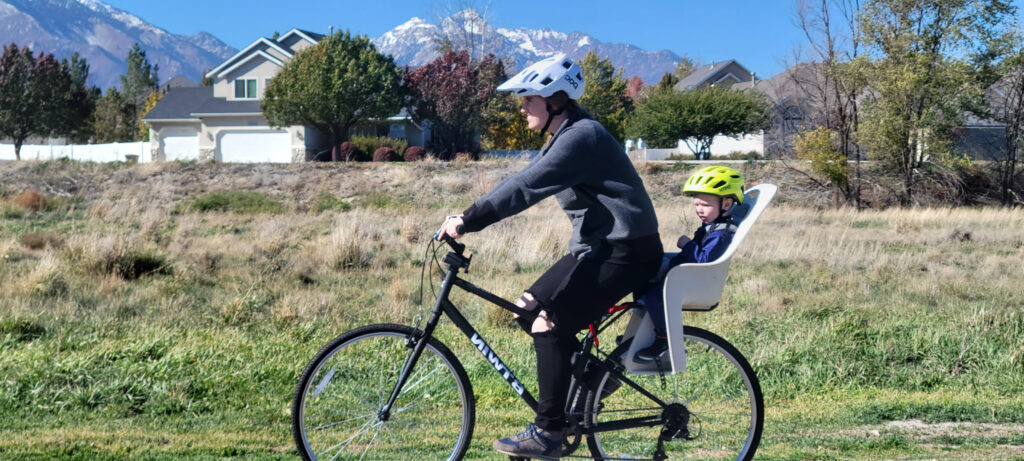 Toddler and Mom riding around Decathlon Elops 100