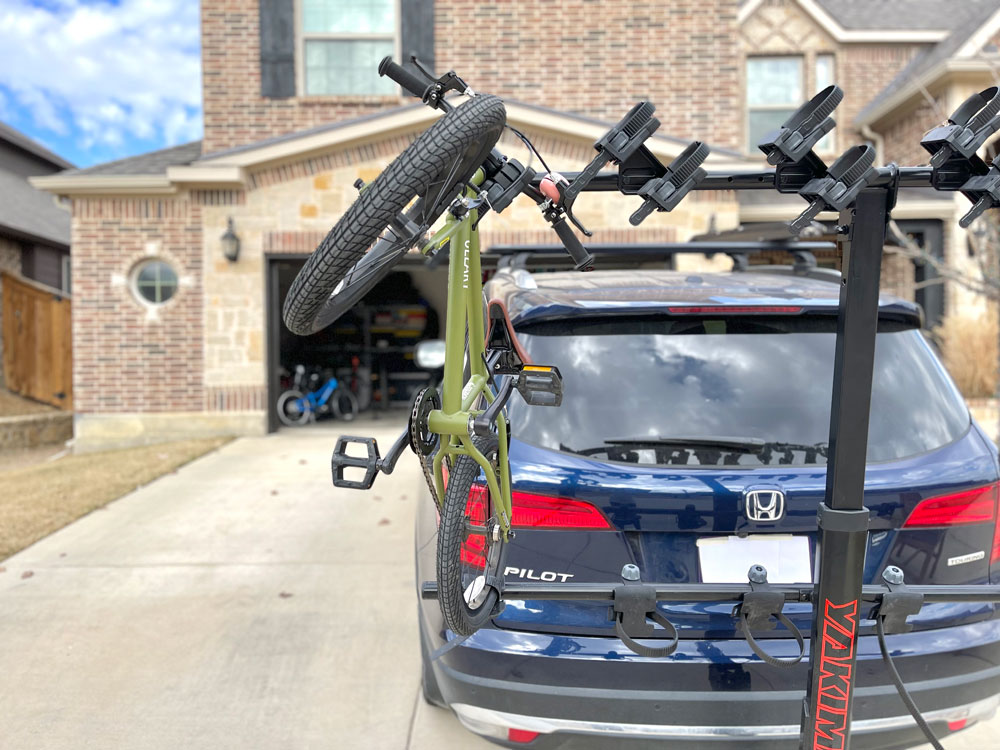 16" bike hanging from the Yakima HangTight rack. Shown from rear to show it hangs crooked.