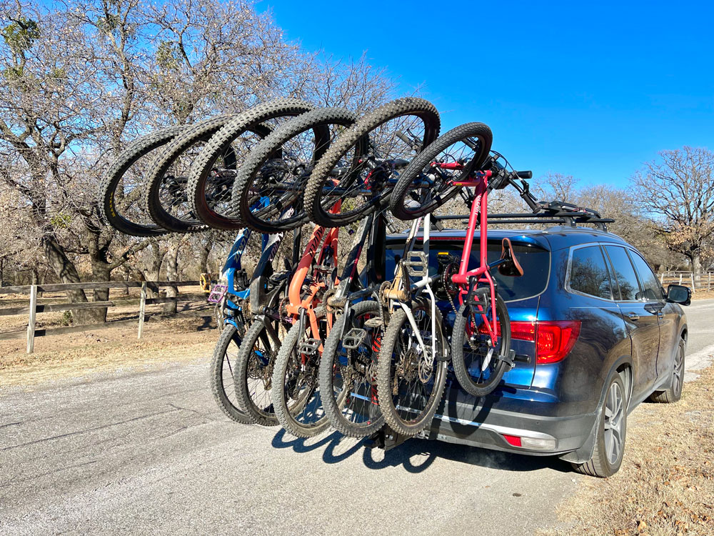 6 mountain bikes hanging from Yakima HangTight 6 capacity vertical bike rack
