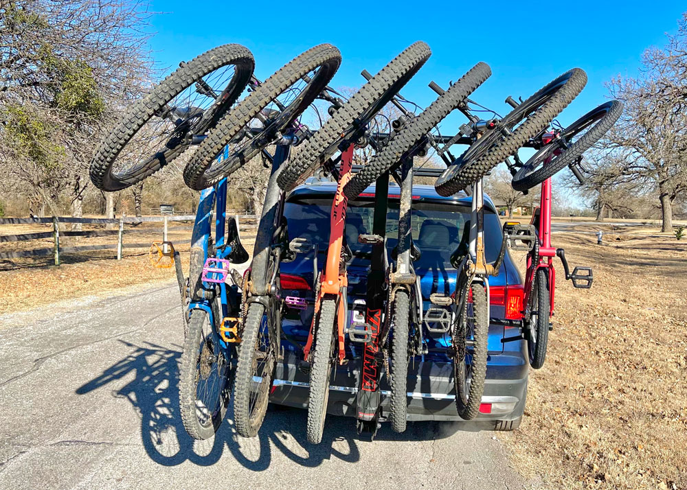 Bikes ranging in wheel size from 20", 26", 27.5", and 29" hanging from the Yakima HangTight