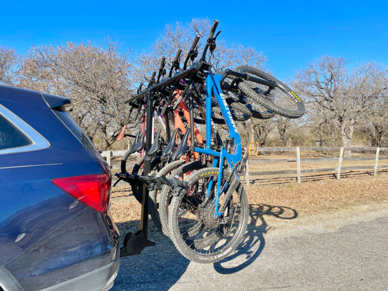 Yakima HangTight vertical hitch rack loaded with 6 mountain bikes.