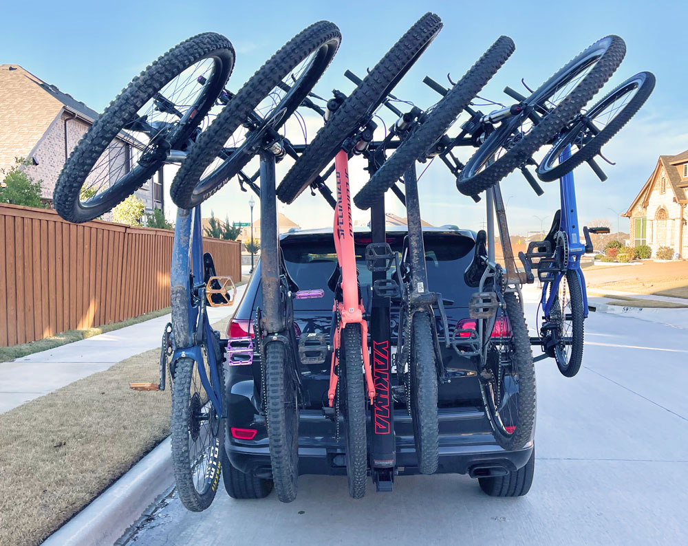 6 mountain bikes loaded on the back of Yakima HangTight shown from rear